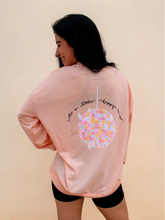 Load image into Gallery viewer, peach crewneck sweatshirt with 3 records that have music notes surrounding them printed on the front, and a colorful disco ball with the phrase "do a little happy dance" printed on the back