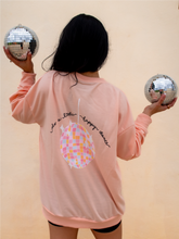 Load image into Gallery viewer, peach crewneck sweatshirt with 3 records that have music notes surrounding them printed on the front, and a colorful disco ball with the phrase "do a little happy dance" printed on the back