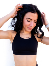 Load image into Gallery viewer, Black sports bra has a slightly higher neck and thick strappy back to provide great comfort and high support.