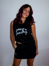 Load image into Gallery viewer, Black v-neck tank with "Stay Peachy" design