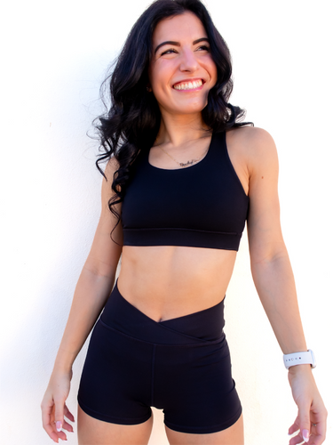 Form fitting, high waisted, black spandex shorts with a criss cross waistband.