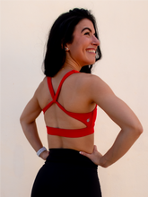 Load image into Gallery viewer, Red sports bra with a simple front, strappy back and light-medium support.