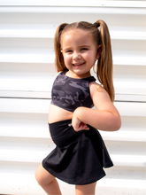 Load image into Gallery viewer, Stretchy, form fitting black tennis skort with built in side pocket.