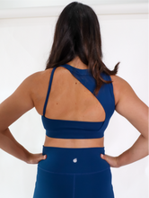 Load image into Gallery viewer, Blue Coffee Run Sports Bra provides a high neckline with ample support and comfort.