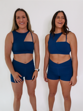 Load image into Gallery viewer, Blue Coffee Run Sports Bra provides a high neckline with ample support and comfort.