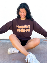 Load image into Gallery viewer, Brown oversized crewneck sweatshirt made of 80% cotton, 20% polyester, displaying a hand-drawn design for fall.