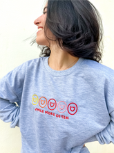 Load image into Gallery viewer, Grey crewneck sweatshirt with multicolor smiley face embroidered design.
