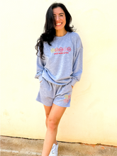 Load image into Gallery viewer, Grey crewneck sweatshirt with multicolor smiley face embroidered design.