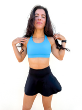 Load image into Gallery viewer, Lady modeling sky blue strappy sports bra.