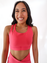 Load image into Gallery viewer, Pink Split Sports Bra has a standard racerback style with a slit on the upper right shoulder area. High support.