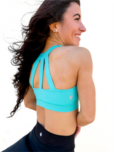 Load image into Gallery viewer, Lady modeling turquoise sporta bra with strappy back.