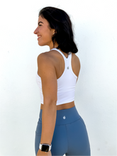 Load image into Gallery viewer, The white Peachy tank is a comfortable cropped tank top with a built in sports bra made for everyday wear.