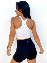 Load image into Gallery viewer, The white Peachy tank is a comfortable cropped tank top with a built in sports bra made for everyday wear.
