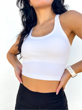 Load image into Gallery viewer, The white Peachy tank is a comfortable cropped tank top with a built in sports bra made for everyday wear.