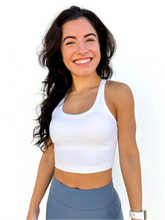 Load image into Gallery viewer, The white Peachy tank is a comfortable cropped tank top with a built in sports bra made for everyday wear.