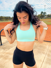 Load image into Gallery viewer, Tiffany Blue sports bra with medium support, removable pads and a criss cross back