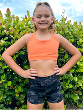 Load image into Gallery viewer, The Youth Peachy Shorts are high-waisted in color black camo with a 75% nylon, 25% spandex blend. Extra stretchy fabric provides extra comfort while still providing a more fitted appearance.