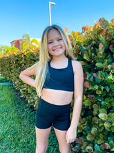 Load image into Gallery viewer, Kids black sports bra with simple front and cute criss cross back