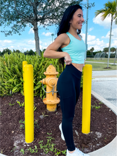 Load image into Gallery viewer, Young lady modeling black buttery soft leggings in black with two side pockets