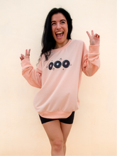 Load image into Gallery viewer, peach crewneck sweatshirt with 3 records that have music notes surrounding them printed on the front, and a colorful disco ball with the phrase &quot;do a little happy dance&quot; printed on the back
