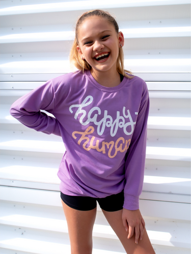 Young girl modeling a purple lightweight, crewneck sweatshirt with a hand-lettered script design saying 