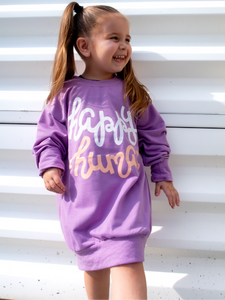 Young girl modeling a purple lightweight, crewneck sweatshirt with a hand-lettered script design saying "happy human" on the front in white and peach.