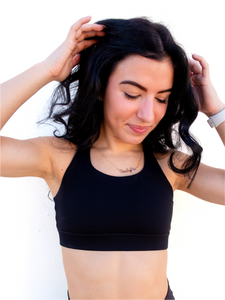 Black sports bra has a slightly higher neck and thick strappy back to provide great comfort and high support.