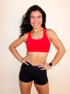 Red sports bra with a simple front, strappy back and light-medium support.