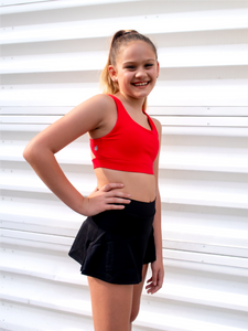 Stretchy, form fitting black tennis skort with built in side pocket.