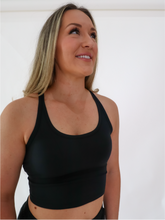 Load image into Gallery viewer, The black Peachy tank is a comfortable cropped tank top with a built in sports bra made for everyday wear.
