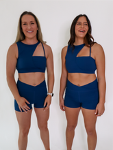 Load image into Gallery viewer, Blue Coffee Run Sports Bra provides a high neckline with ample support and comfort.
