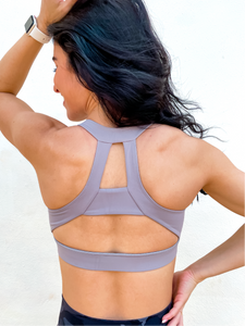 Grey sports bra has a slightly higher neck and thick strappy back to provide great comfort and high support.