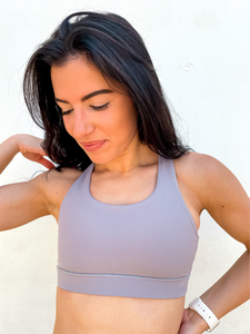 Grey sports bra has a slightly higher neck and thick strappy back to provide great comfort and high support.