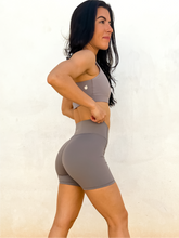 Load image into Gallery viewer, Young lady modeling comfortable, soft and stretchy grey biker shorts
