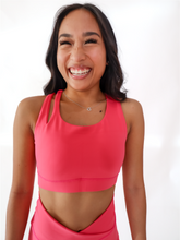 Load image into Gallery viewer, Pink Split Sports Bra has a standard racerback style with a slit on the upper right shoulder area. High support.
