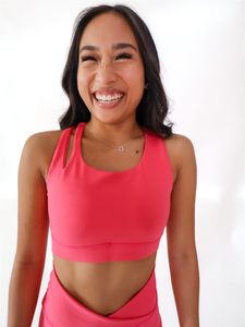 Pink Split Sports Bra has a standard racerback style with a slit on the upper right shoulder area. High support.