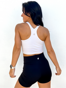 The white Peachy tank is a comfortable cropped tank top with a built in sports bra made for everyday wear.
