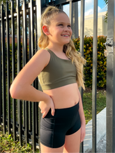 Load image into Gallery viewer, The Youth Peachy Shorts are high-waisted in color black with a 75% nylon, 25% spandex blend. Extra stretchy fabric provides extra comfort while still providing a more fitted appearance.
