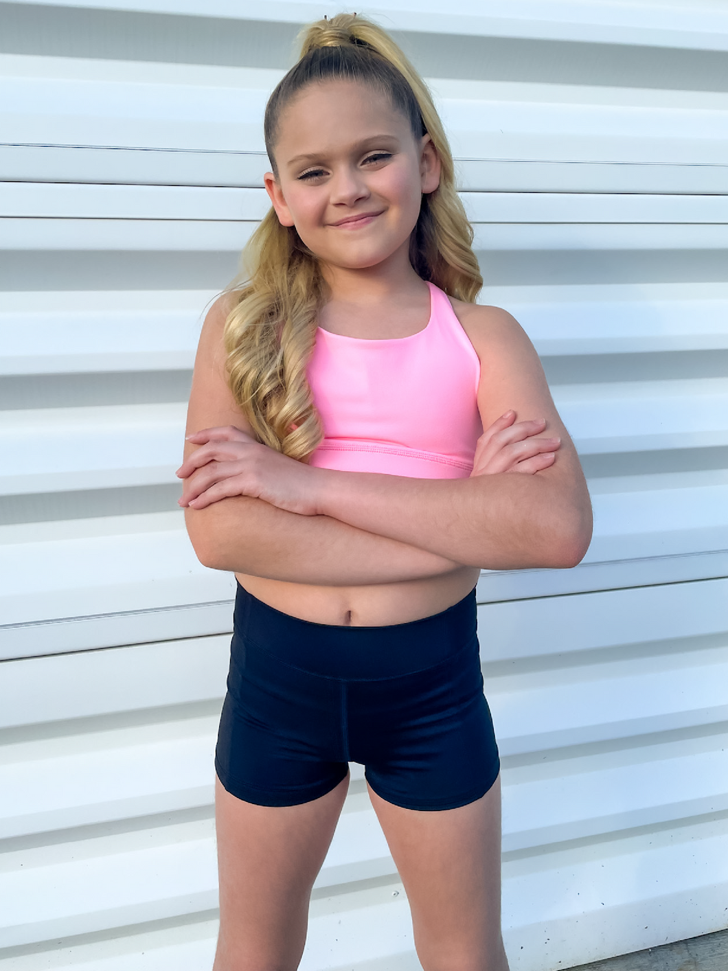 The Youth Peachy Shorts are high-waisted in color black with a 75% nylon, 25% spandex blend. Extra stretchy fabric provides extra comfort while still providing a more fitted appearance.