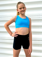 Load image into Gallery viewer, Young girl modeling sky blue strappy sports bra.
