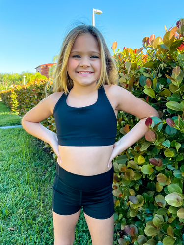 Kids black sports bra with simple front and cute criss cross back